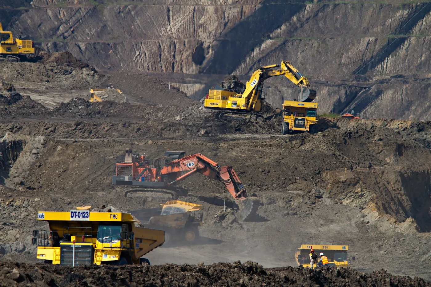 Earthmoving machinery across a large excavation site